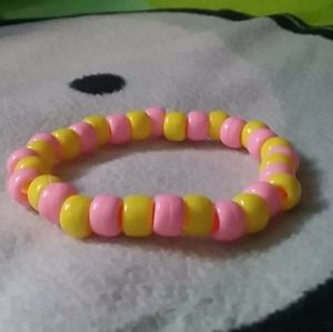 pink and yellow kandi bracelet